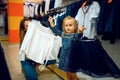 Mother and little baby choosing skirt, kid`s store Royalty Free Stock Photo