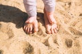 Mother and little baby feet on beach sand. Royalty Free Stock Photo