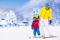 Mother and little boy learning to ski Royalty Free Stock Photo