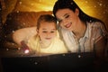 Mother with little child reading magic book Royalty Free Stock Photo