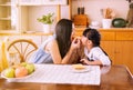 Mother and little daughter having fun with breakfast together at home kitchen in the morning,Healthy food concept Royalty Free Stock Photo