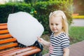 Mother and little daughter eating cotton candy Royalty Free Stock Photo