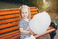 Mother and little daughter eating cotton candy Royalty Free Stock Photo