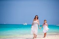 Mother and little daughter enjoying time at tropical beach Royalty Free Stock Photo