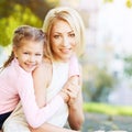 Mother and little daughter. Happy family portrait. Mom hug. Outdoor lifestyle Royalty Free Stock Photo