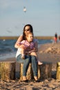 Mother and little daughter having fun on the beach. Authentic lifestyle image Royalty Free Stock Photo