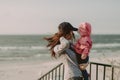 Mother and little daughter having fun on the beach. Authentic lifestyle image Royalty Free Stock Photo