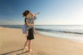 Mother with little daughter on her arm at the beach Royalty Free Stock Photo