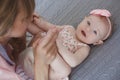 Mother and little daughter in play in the bedroom on the bed Royalty Free Stock Photo