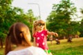 Mother and little daughter playing together in park. Outdoor Portrait of happy family. Happy Mother`s Day Joy. Royalty Free Stock Photo