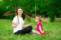 Mother and little daughter playing together in park. Outdoor Portrait of happy family. Happy Mother`s Day Joy. Royalty Free Stock Photo