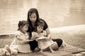 Mother and little daughter reading book together in the park Royalty Free Stock Photo