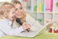 Mother with little daughter singing songs