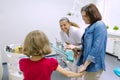 Mother and little daughter visiting pediatric dentist at dental clinics