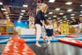 Mother and little girl jumping on a trampoline Royalty Free Stock Photo