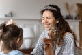 Mother and little kid girl play with hand puppet toys