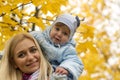 Mother and little kid playing together in a park