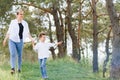 Mother and little son happy family. Attractive mom,kid boy are walking carefree outdoors summer. Parent woman goes on nature Royalty Free Stock Photo