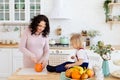 Mother and little son in the kitchen Royalty Free Stock Photo