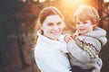 Mother and little son in park or forest, outdoors. Hugging and having fun together. Happy toddler boy and young mum, kid Royalty Free Stock Photo