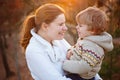 Mother and little son in park or forest, outdoors. Royalty Free Stock Photo