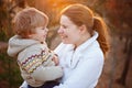 Mother and little son in park or forest, outdoors. Royalty Free Stock Photo