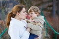 Mother and little son in park or forest, outdoors. Royalty Free Stock Photo