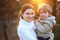 Mother and little son in park or forest, outdoors. Royalty Free Stock Photo