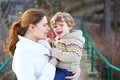 Mother and little son in park or forest, outdoors. Royalty Free Stock Photo