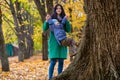 Mother with little son plays in autumn park Royalty Free Stock Photo