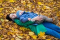 Mother with little son plays in autumn park Royalty Free Stock Photo