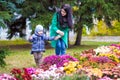 Mother with little son plays in autumn park Royalty Free Stock Photo