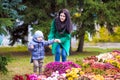 Mother with little son plays in autumn park Royalty Free Stock Photo