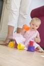 Mother in living room with baby Royalty Free Stock Photo