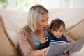 Mother looking at a book with her son Royalty Free Stock Photo