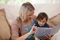 Mother looking at a book with her son Royalty Free Stock Photo