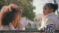 Mother looking daughter tenderness relaxing outdoors close up. African family Royalty Free Stock Photo