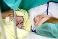 Mother looking for first time her baby being born via Caesarean Section Royalty Free Stock Photo