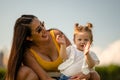 Mother looking at baby girl clapping Royalty Free Stock Photo