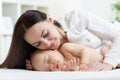 Mother looking at her sleeping newborn baby Royalty Free Stock Photo