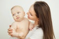 Mother looks at child with care love, baby on arms Royalty Free Stock Photo