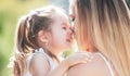 Mother love. Mother and child girl playing kissing and hugging. Little daughter hugging her happy mother. Royalty Free Stock Photo
