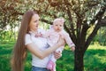 Mother with love and tenderness looks at child. Mom hold little daughter on hands. Parenthood motherhood concept Royalty Free Stock Photo