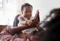 Mother Lying On Sofa At Home Playing Clapping Game With Baby Daughter Royalty Free Stock Photo