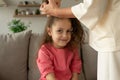 mother makes hair for her daughter Royalty Free Stock Photo