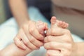 Mother making baby feet massage for newborn infant child. Mom massaging legs of small baby son.Children healthcare and happy Royalty Free Stock Photo