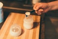 Mother making baby formula in milk bottle