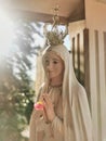 Mother Mary statue praying with her hands joined ,with a crown. Our Lady of Fatima