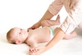 Mother massaging baby Royalty Free Stock Photo