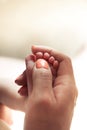 Mother massaging her baby feet Royalty Free Stock Photo